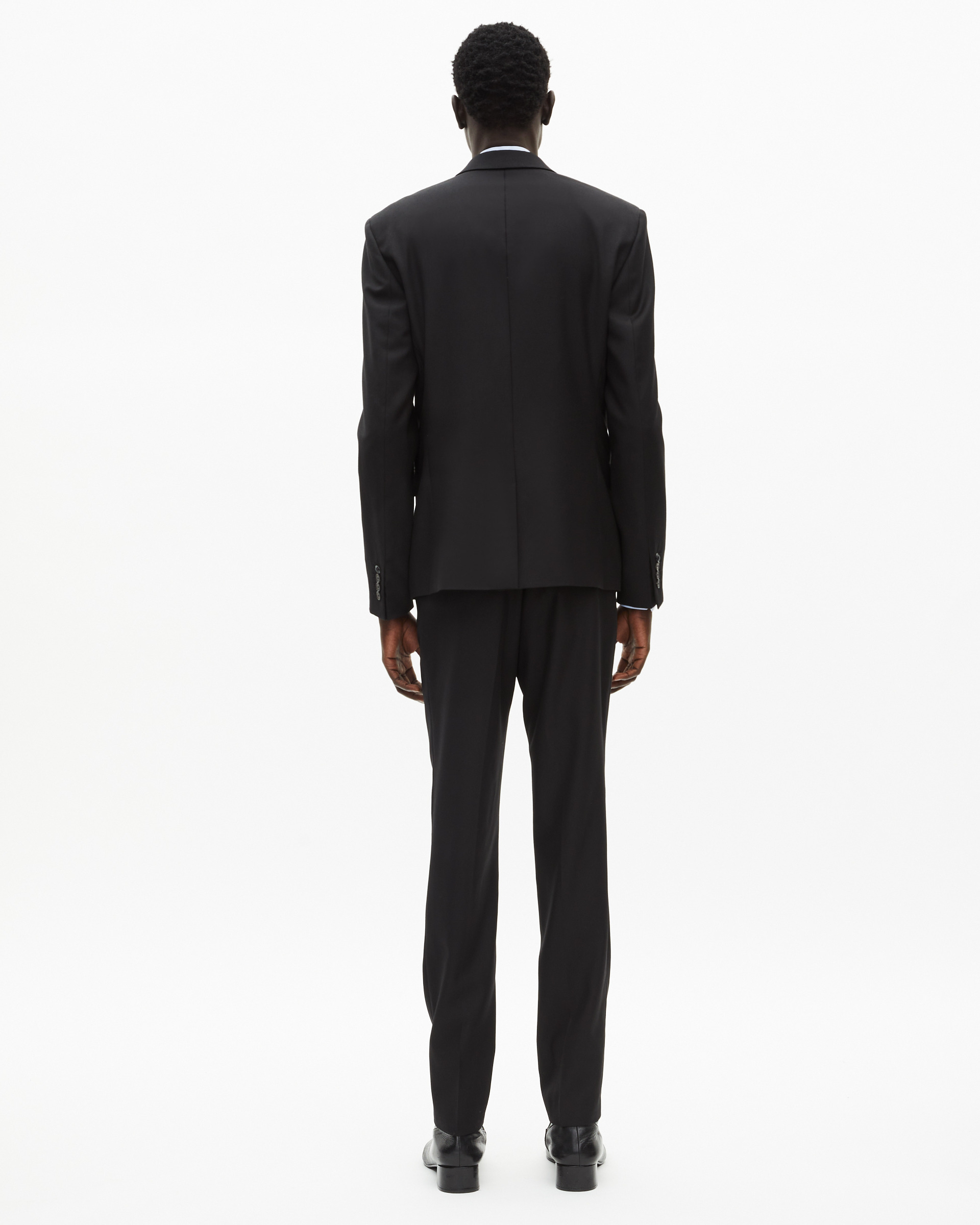 Veste de costume en laine noire coupe tailleur ajustée