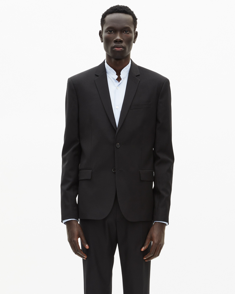 Veste de costume en laine noire coupe tailleur ajustée
