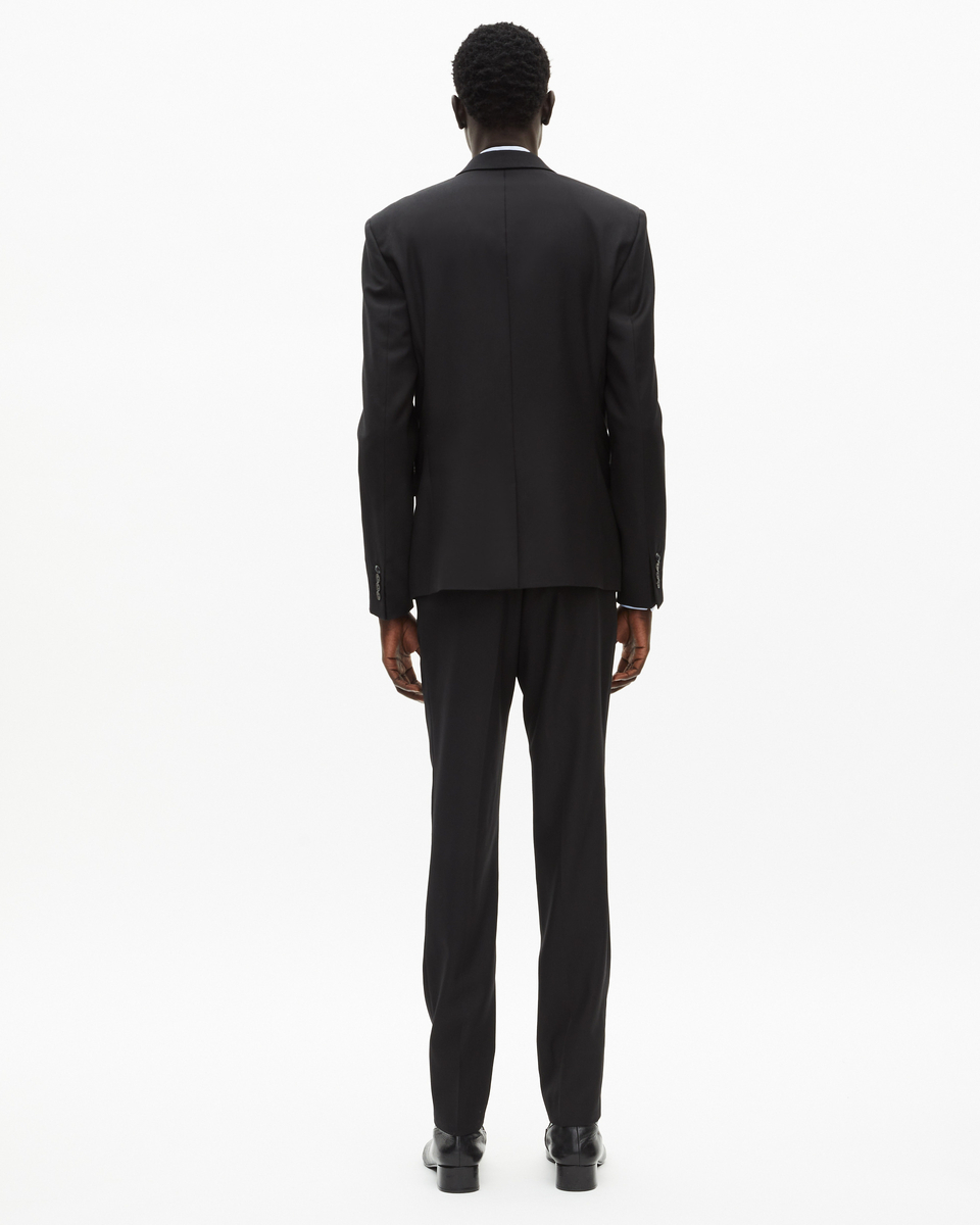 Veste de costume en laine noire coupe tailleur ajustée