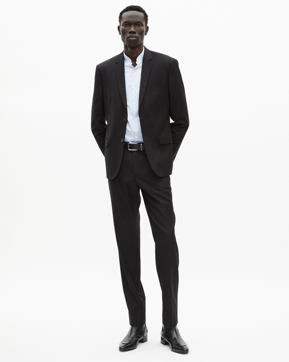 Veste de costume en laine noire coupe tailleur ajustée