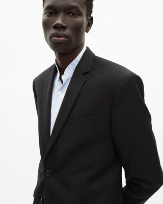 Veste de costume en laine noire coupe tailleur ajustée