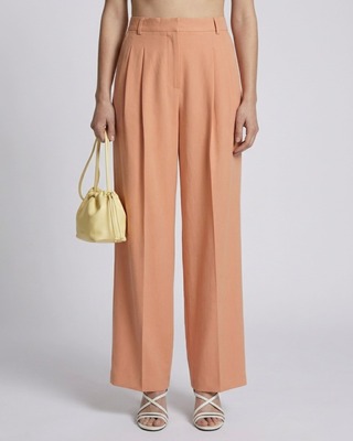 Pantalon de tailleur à pinces large en lin et coton orange clair