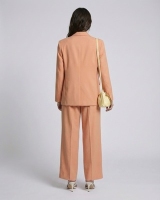 Pantalon de tailleur à pinces large en lin et coton orange clair