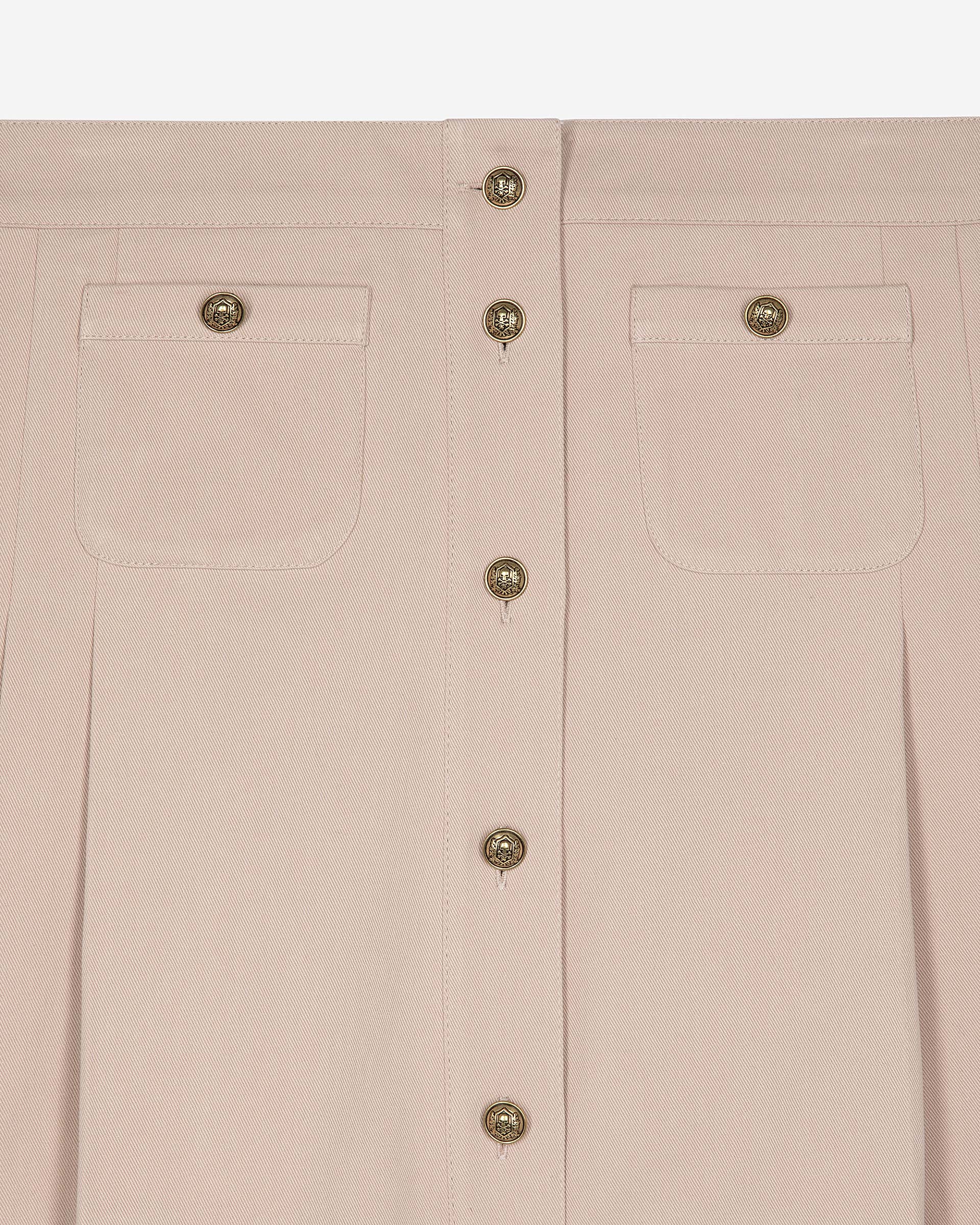 Short pleated skirt in light pink