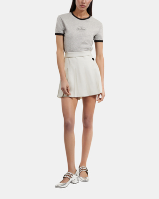 Short ecru pleated skirt