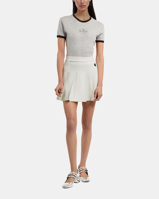 Short ecru pleated skirt