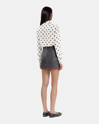 Short black leather skirt
