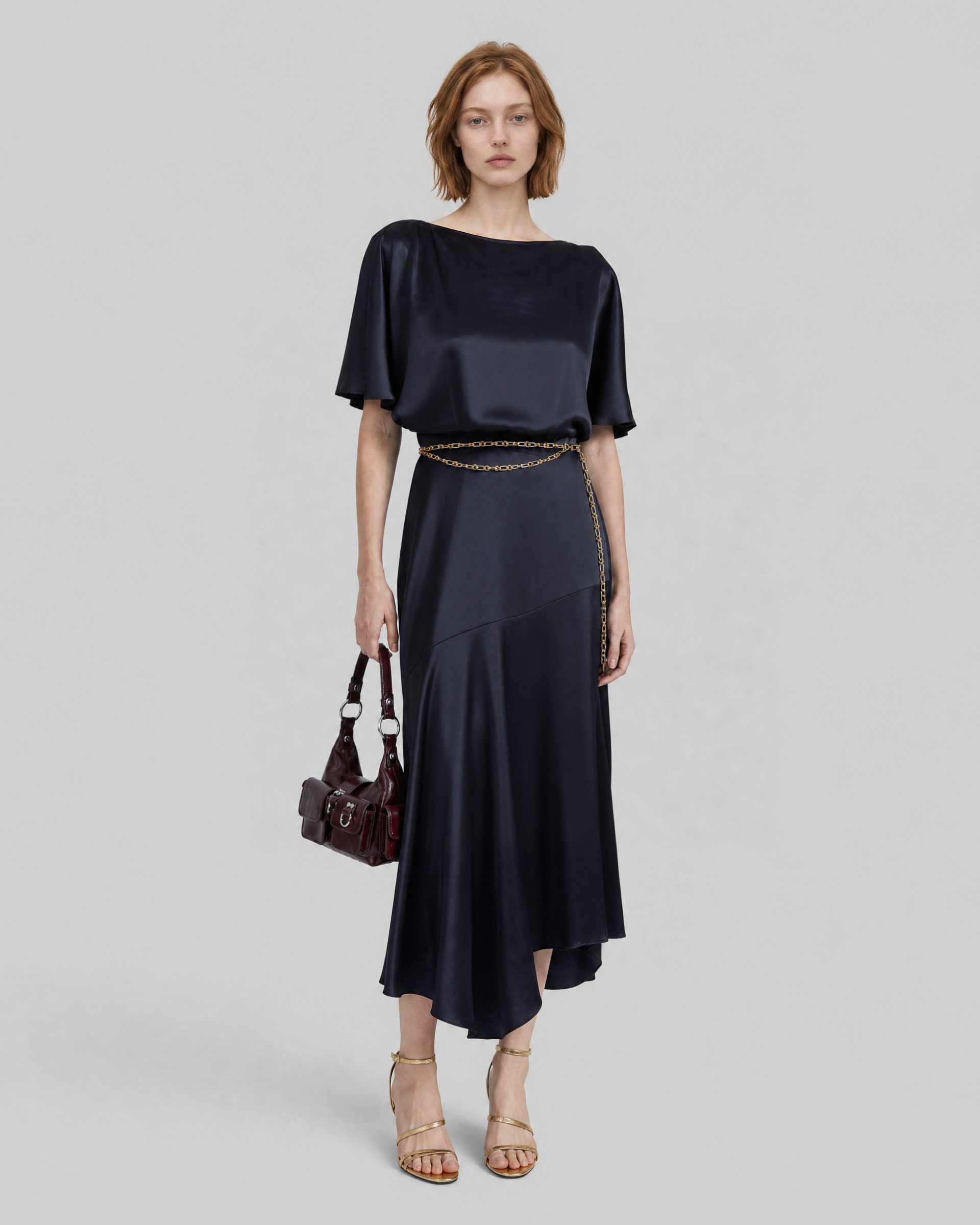 Long satin dress with a navy gold chain
