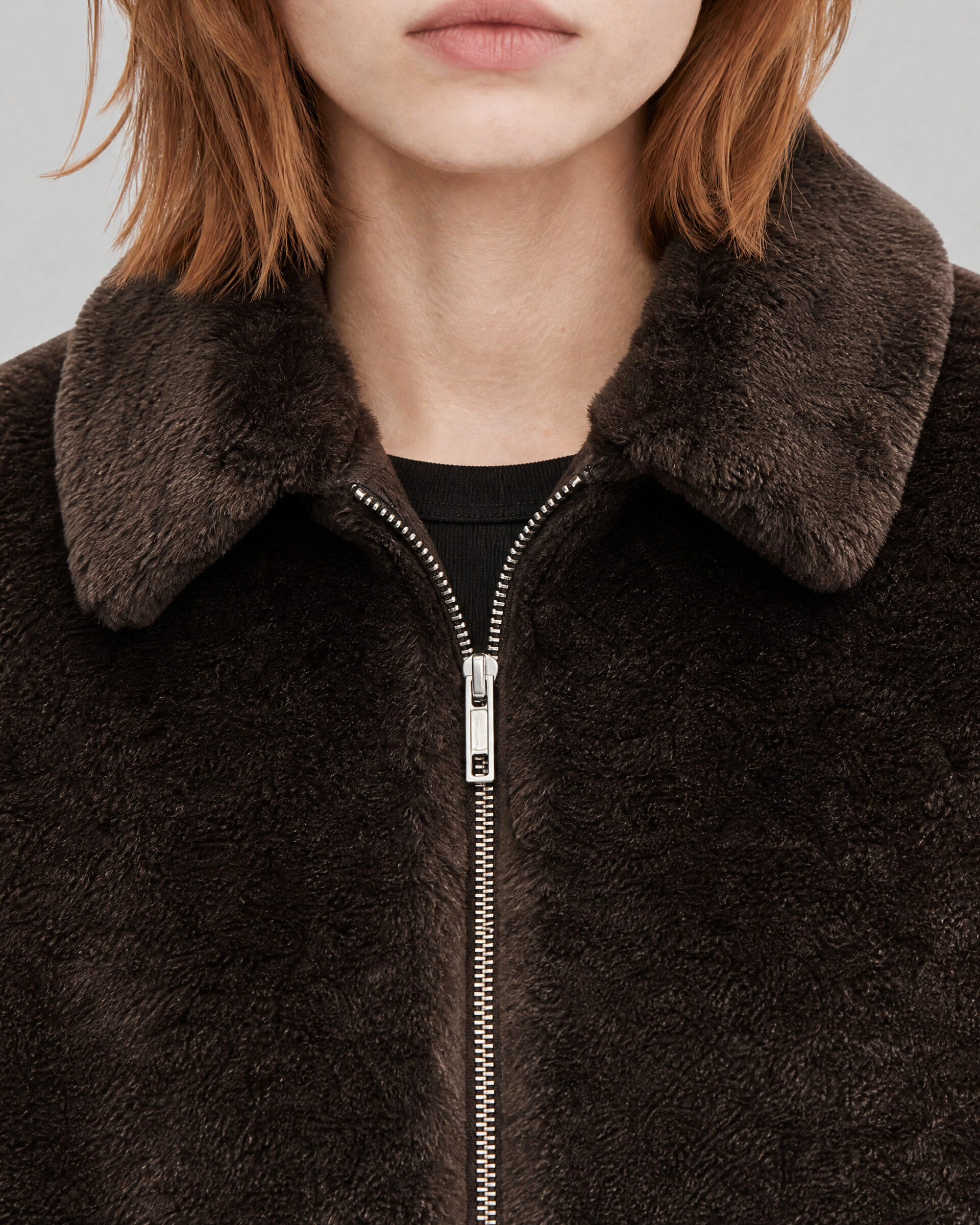 Brown faux fur coat with a zipper