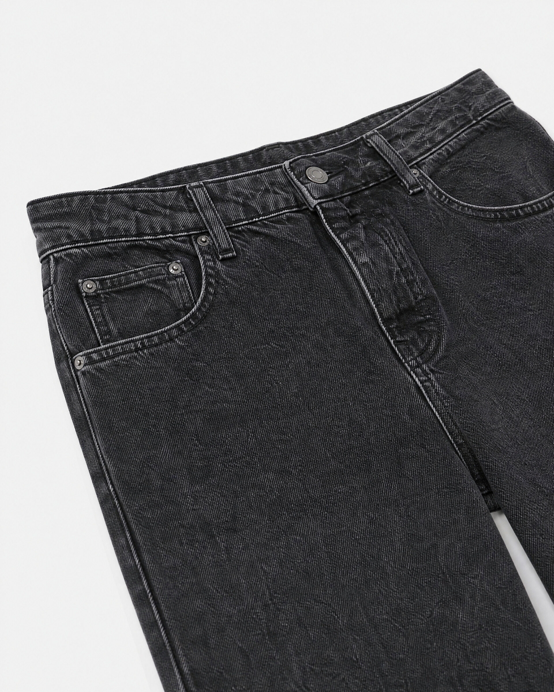 Black straight-leg jeans with a faded wash