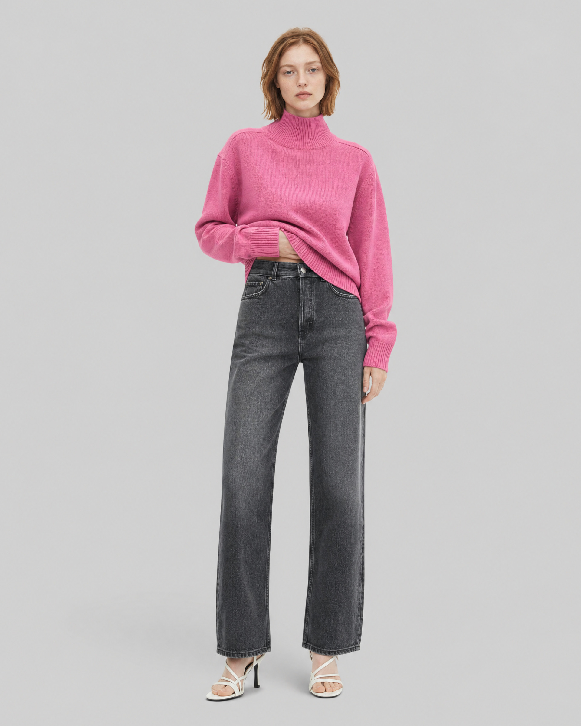Black straight-leg jeans with a faded wash
