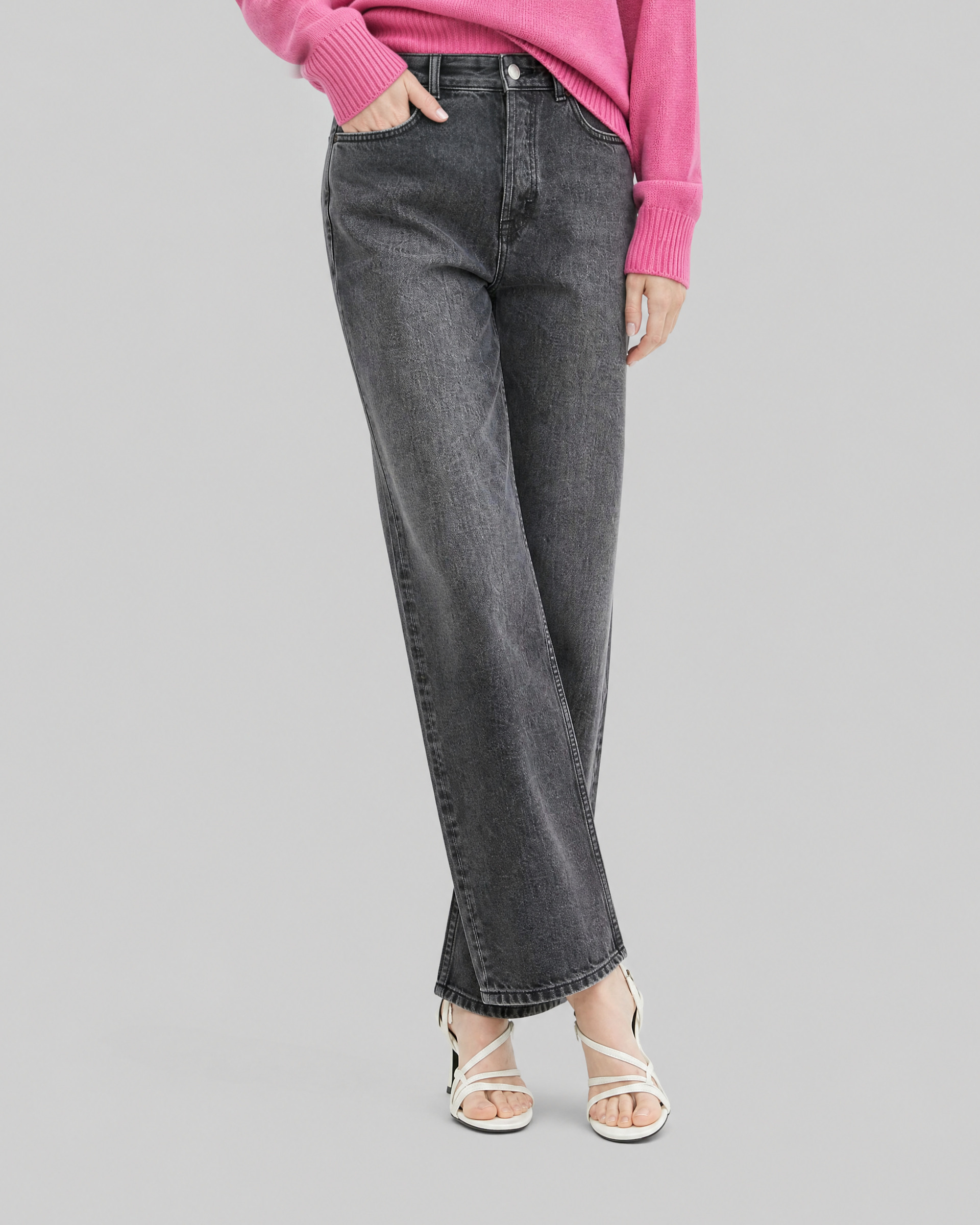 Black straight-leg jeans with a faded wash
