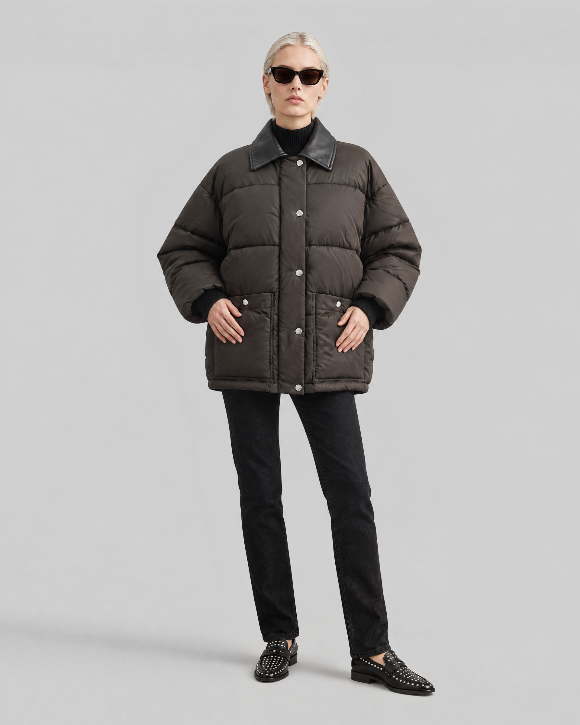 Oversized puffer jacket with brown leather collar