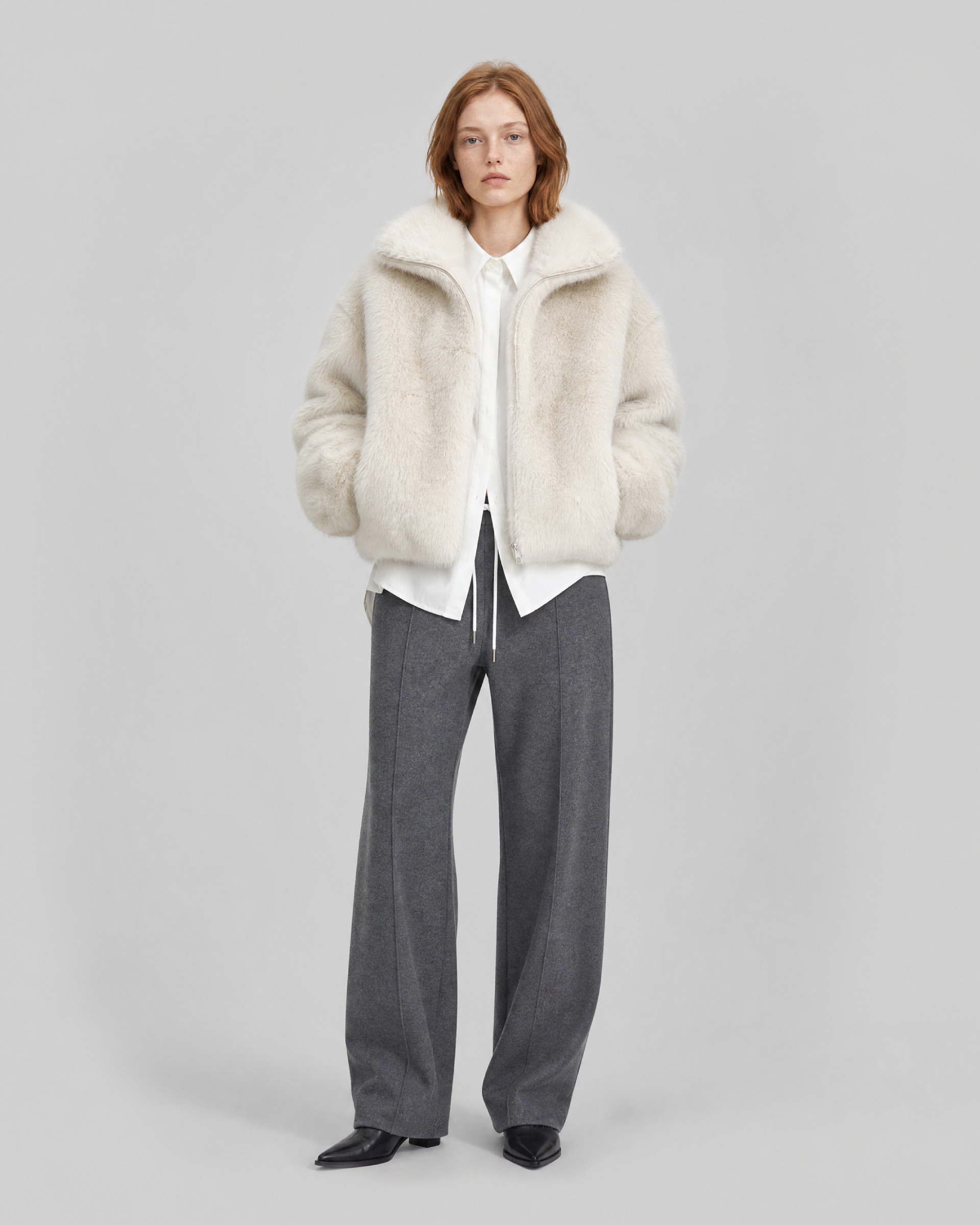 Ecru faux fur coat with a high collar
