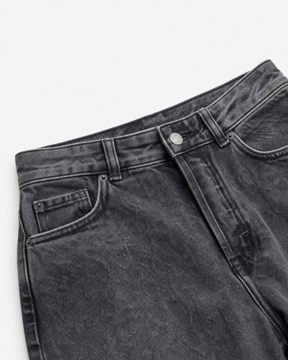 Black straight-leg jeans with a faded wash