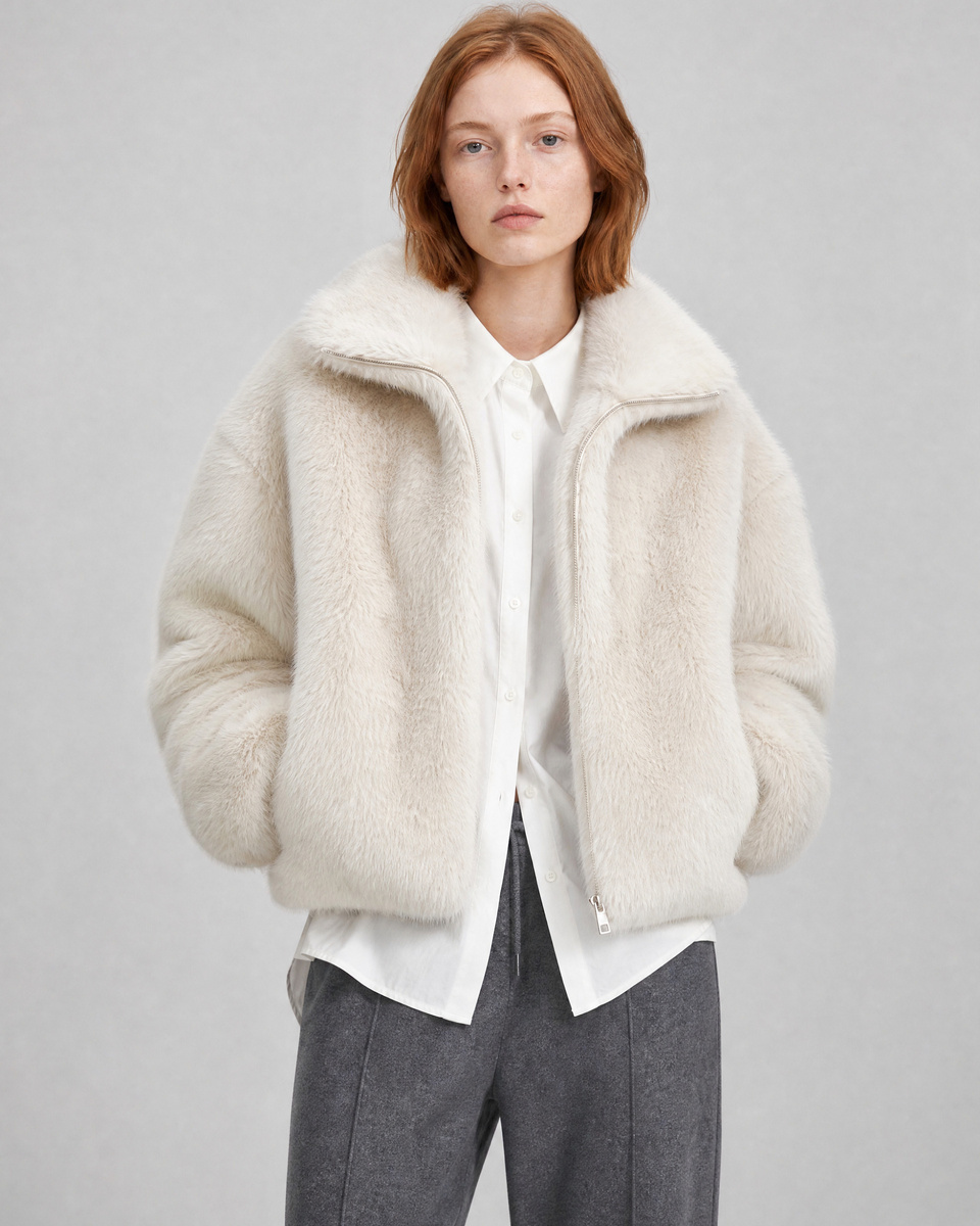 Ecru faux fur coat with a high collar