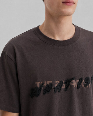 What is brown denim patch t-shirt