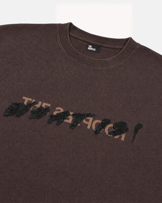 What is brown denim patch t-shirt