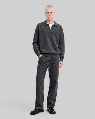 Black straight-leg jeans with a faded wash
