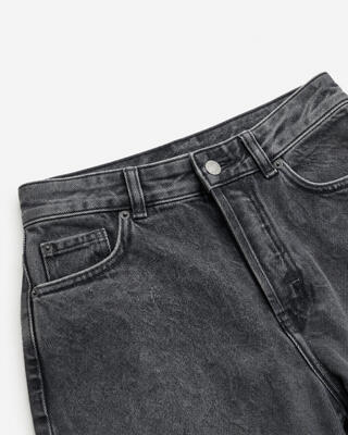 Black straight-leg jeans with a faded wash