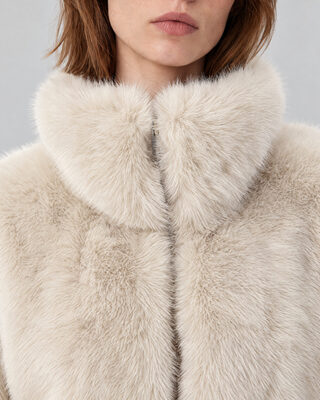 Ecru faux fur coat with a high collar