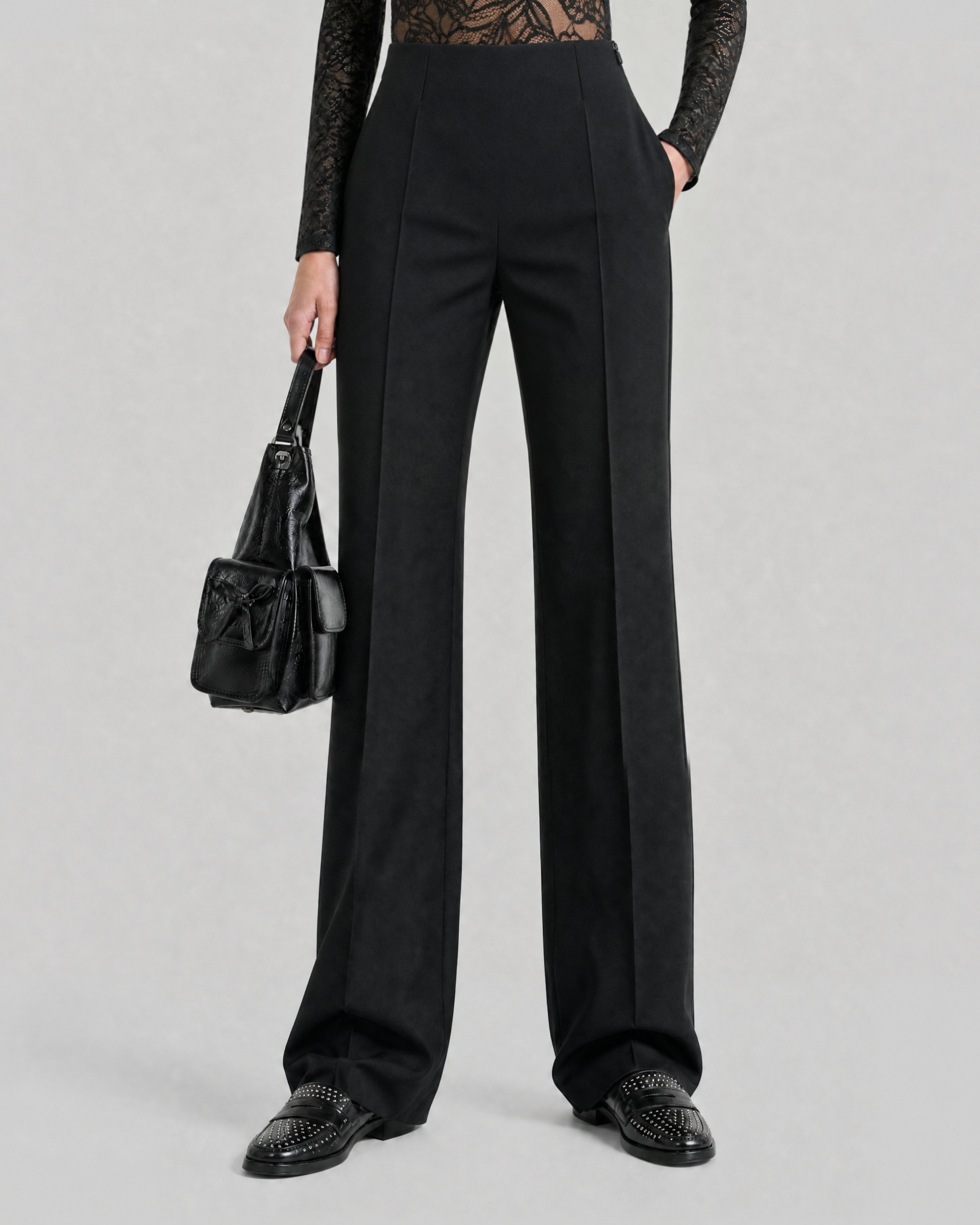 Black, fitted tailored pants made of a wool blend
