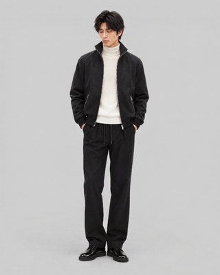 Black zip-up jacket with a high collar