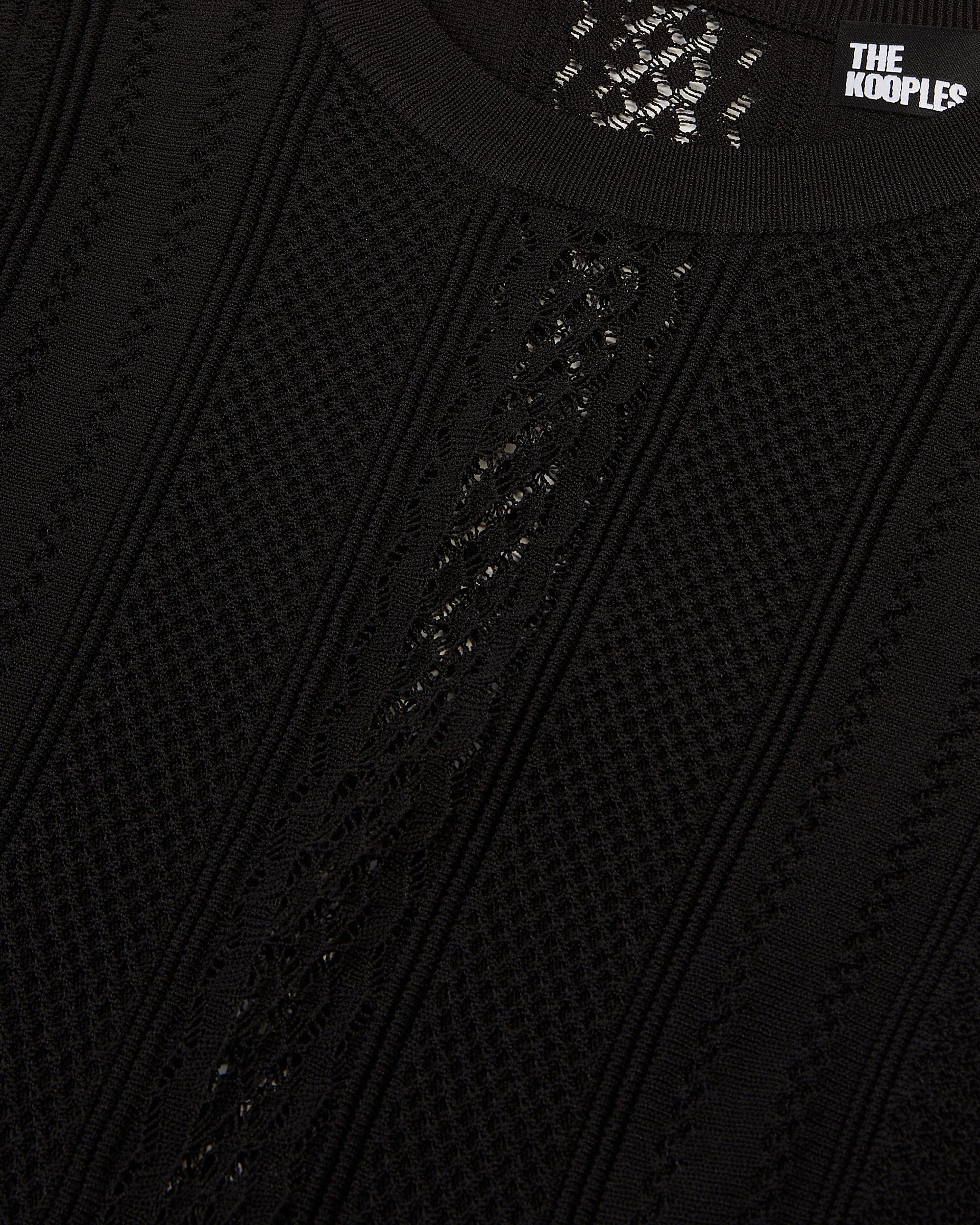 Long black openwork knit dress with openings