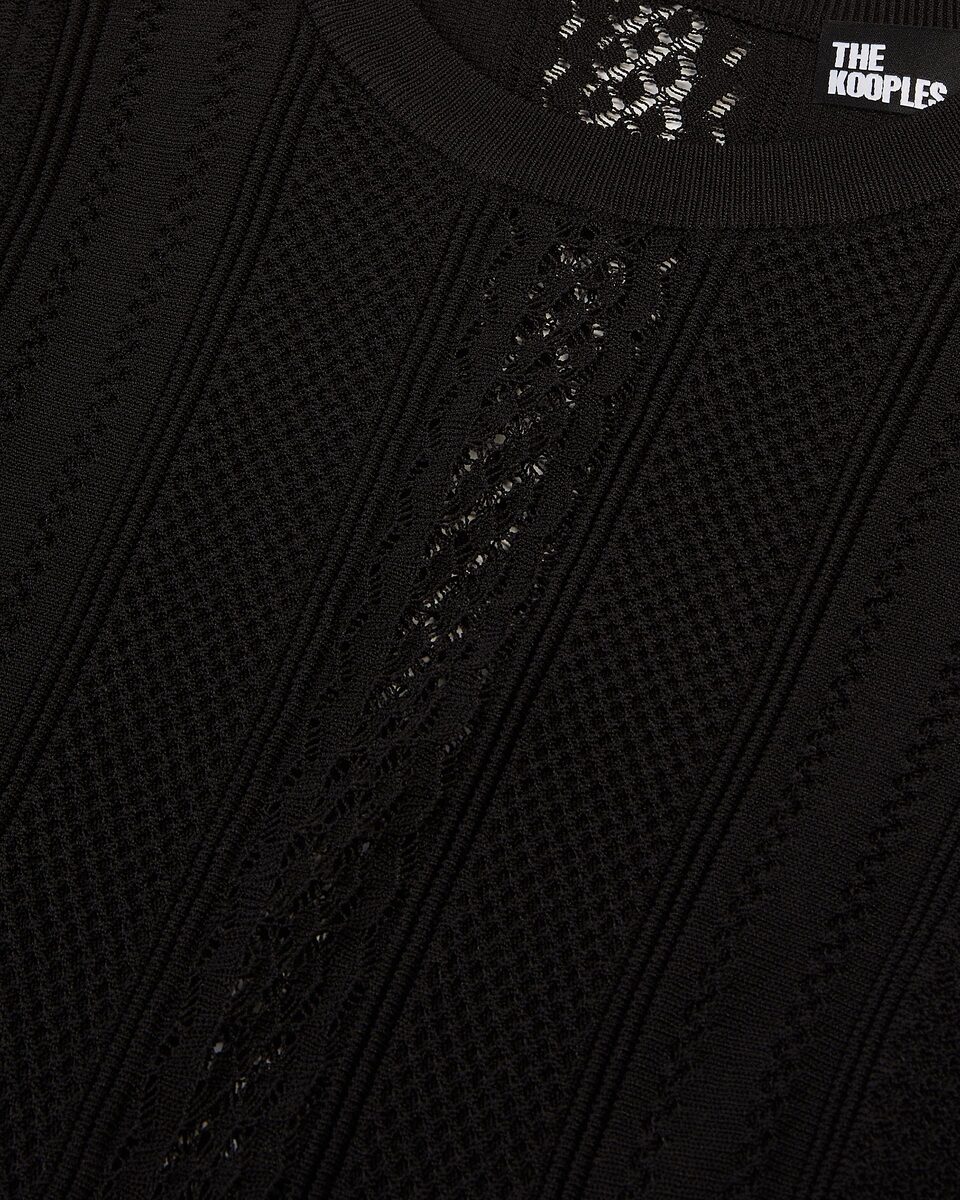 Long black openwork knit dress with openings