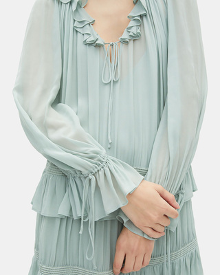 Short dress with blue ruffles