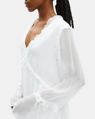 Short ecru dress with ruffles