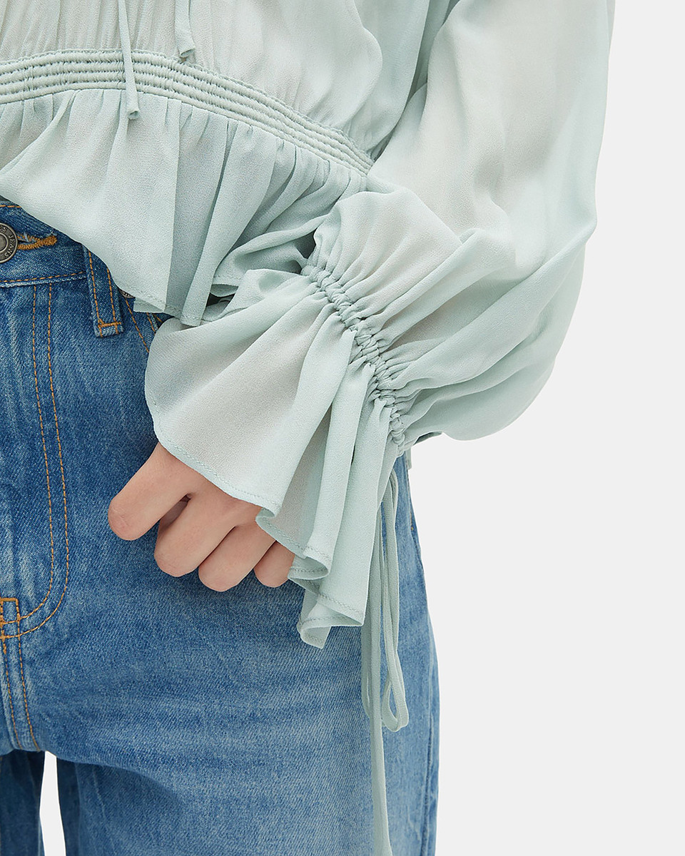 Blue blouse with ruffles