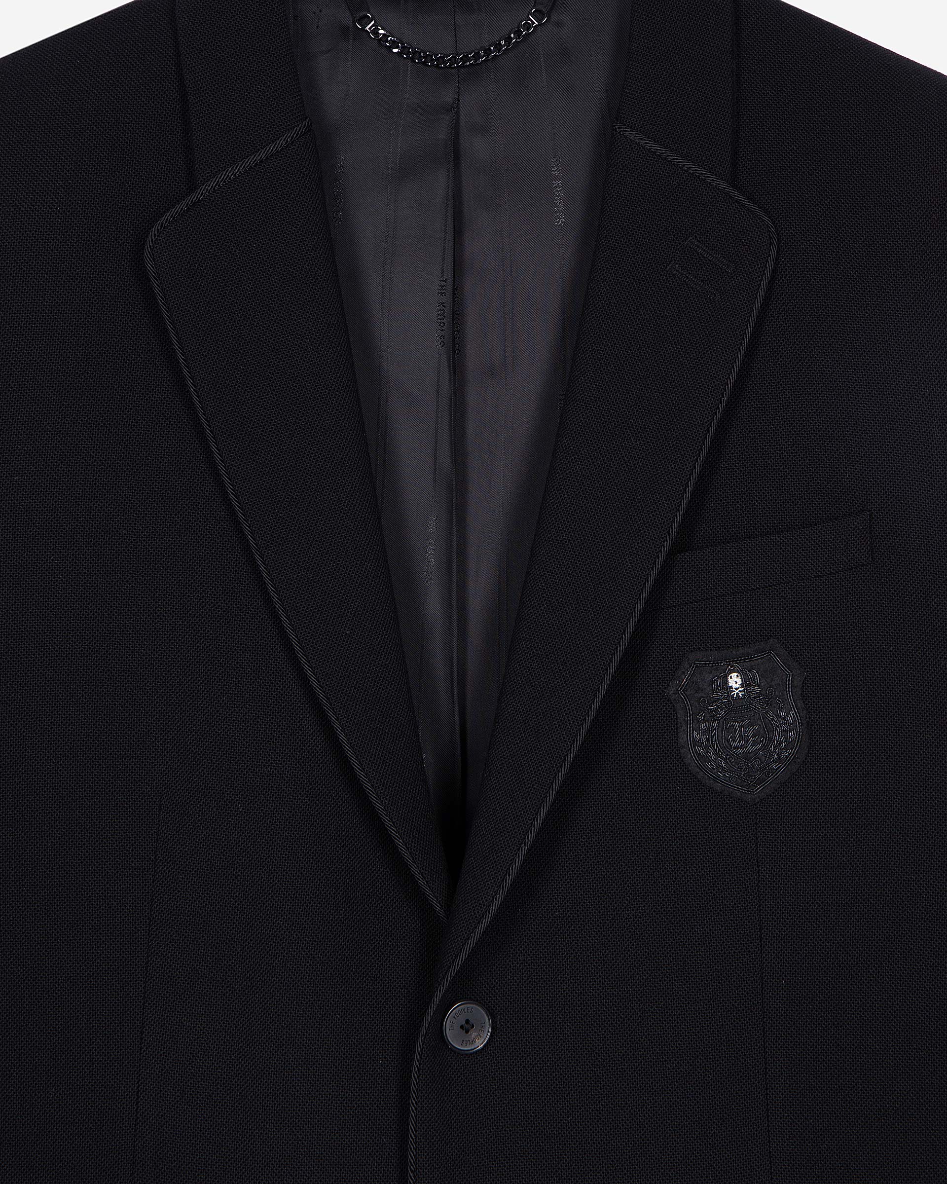Straight jacket in black pique wool