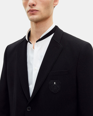 Straight jacket in black pique wool