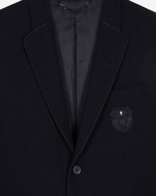 Straight jacket in black pique wool