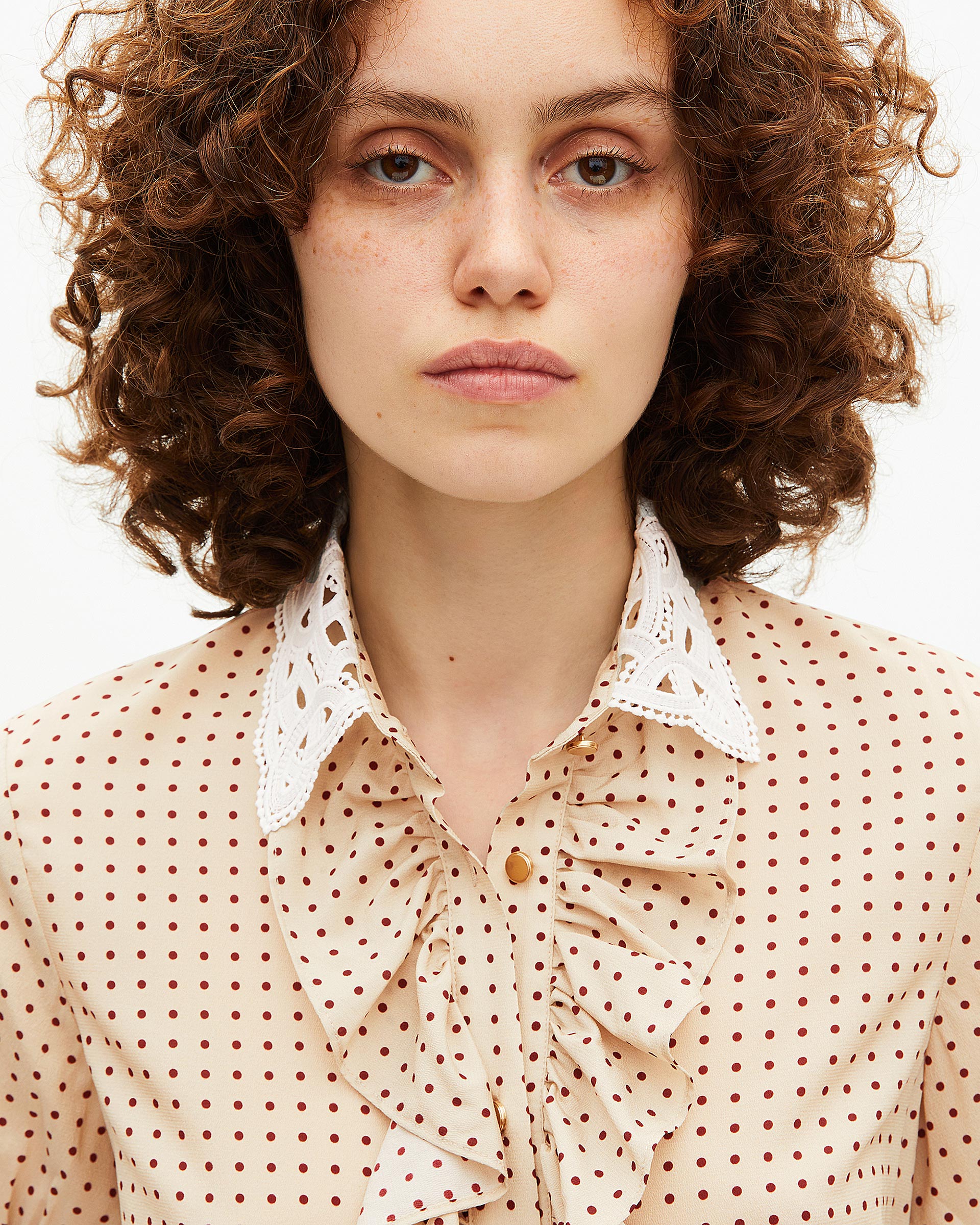 Short-sleeved beige polka-dot shirt