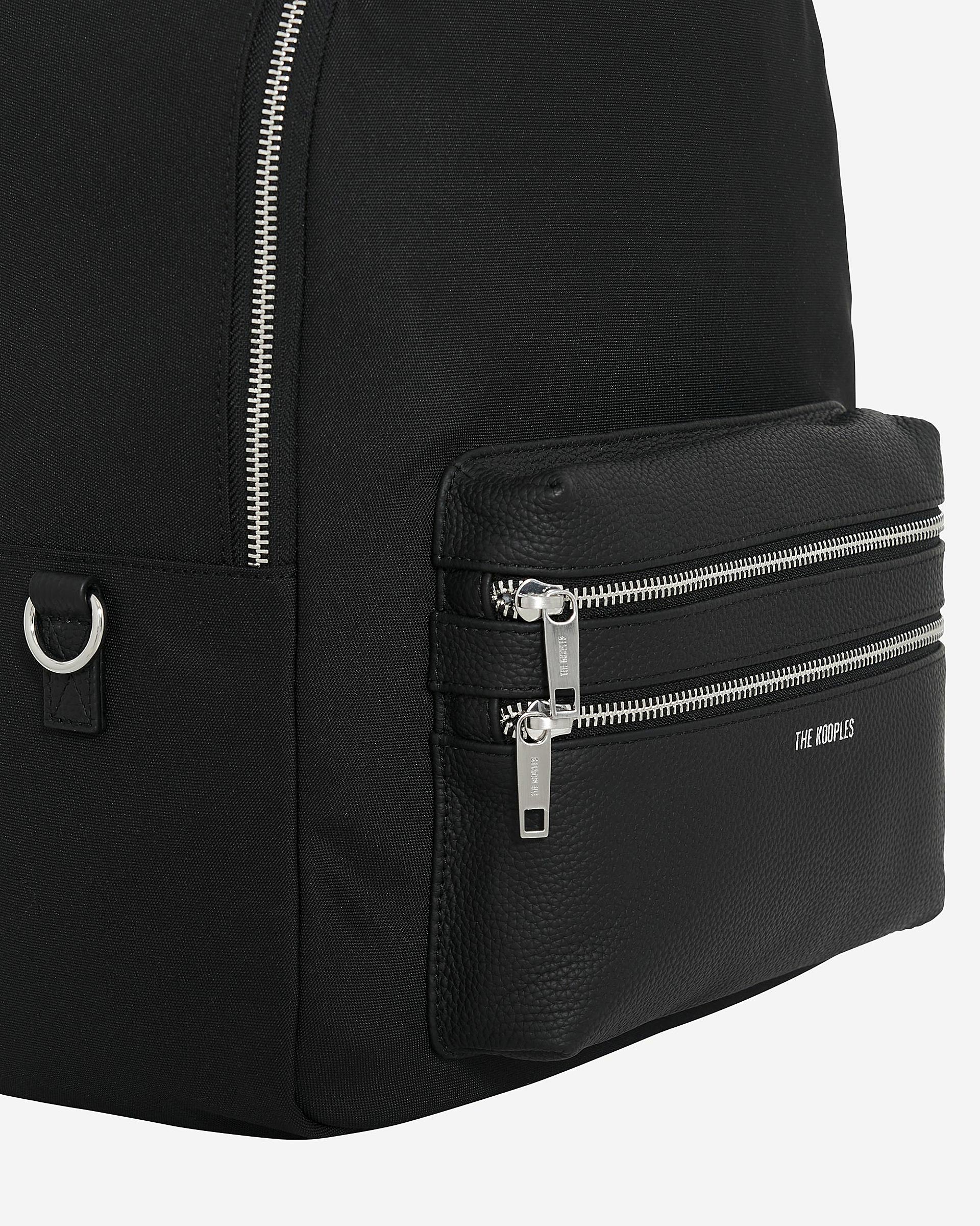 Black canvas and grained leather backpack