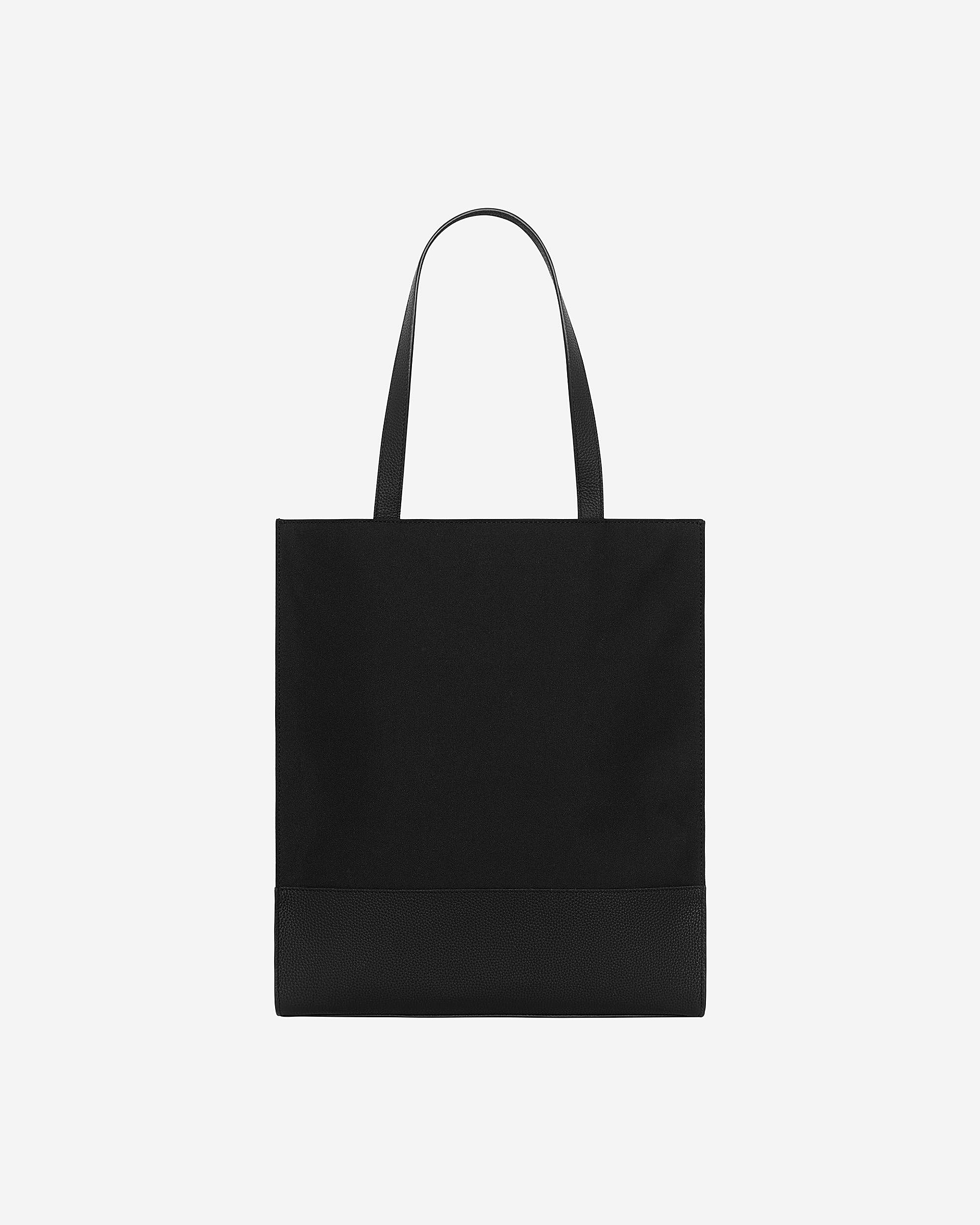 Black canvas and grained leather tote bag