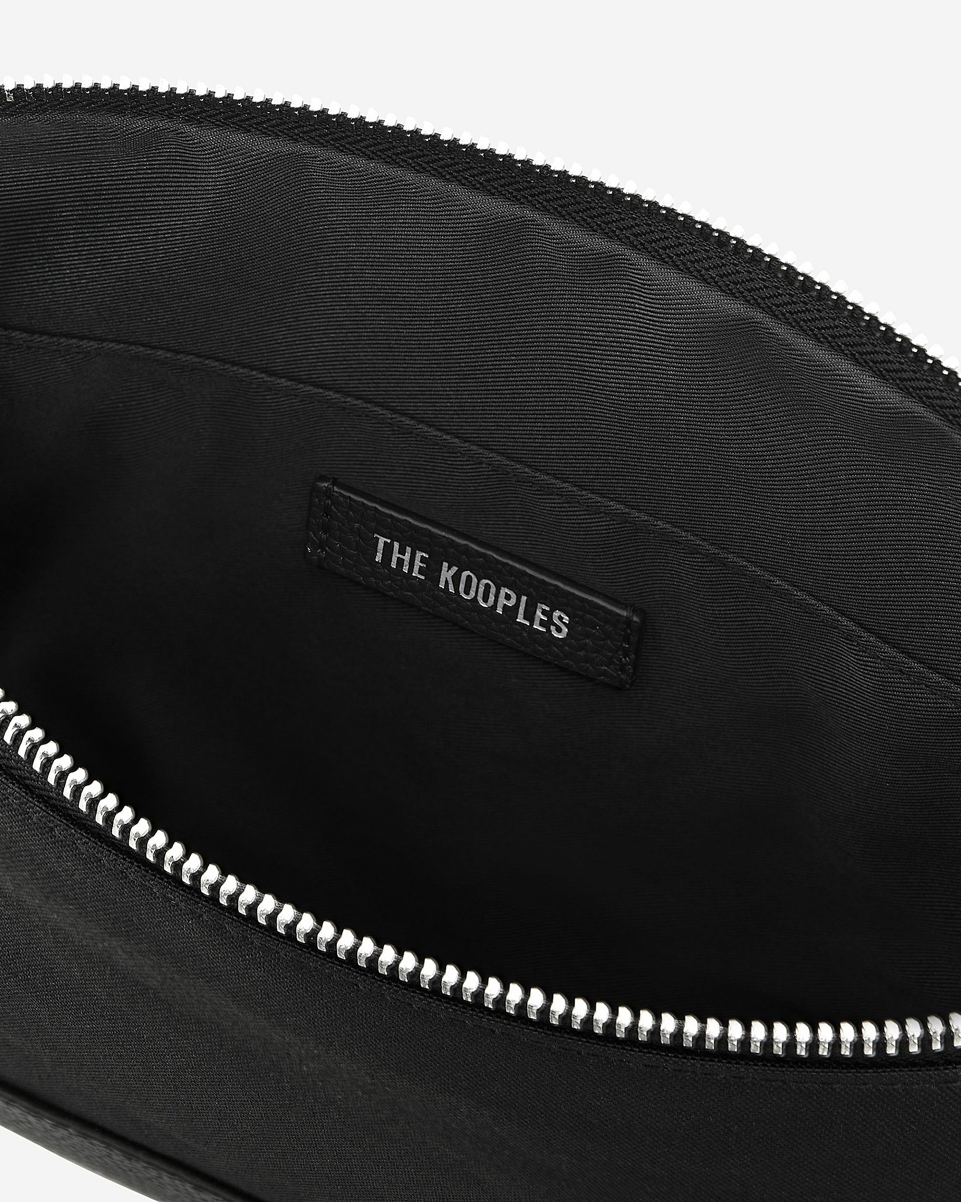 Black canvas and grained leather travel pouch