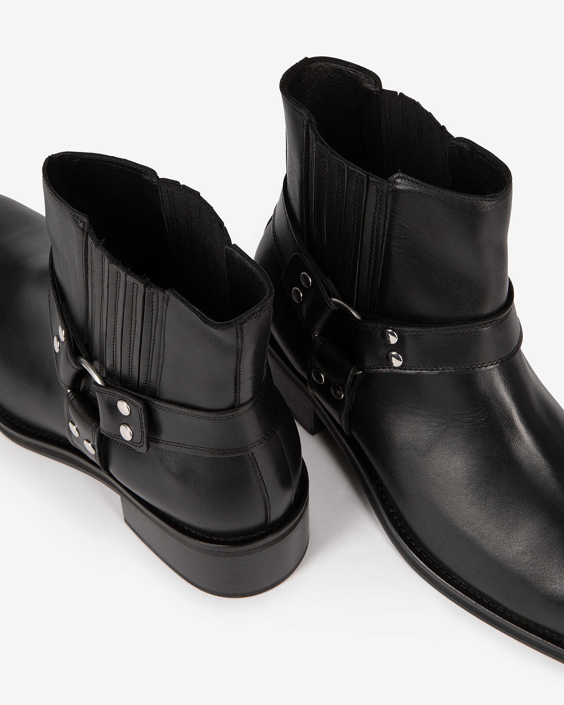 Black leather ankle boots with straps