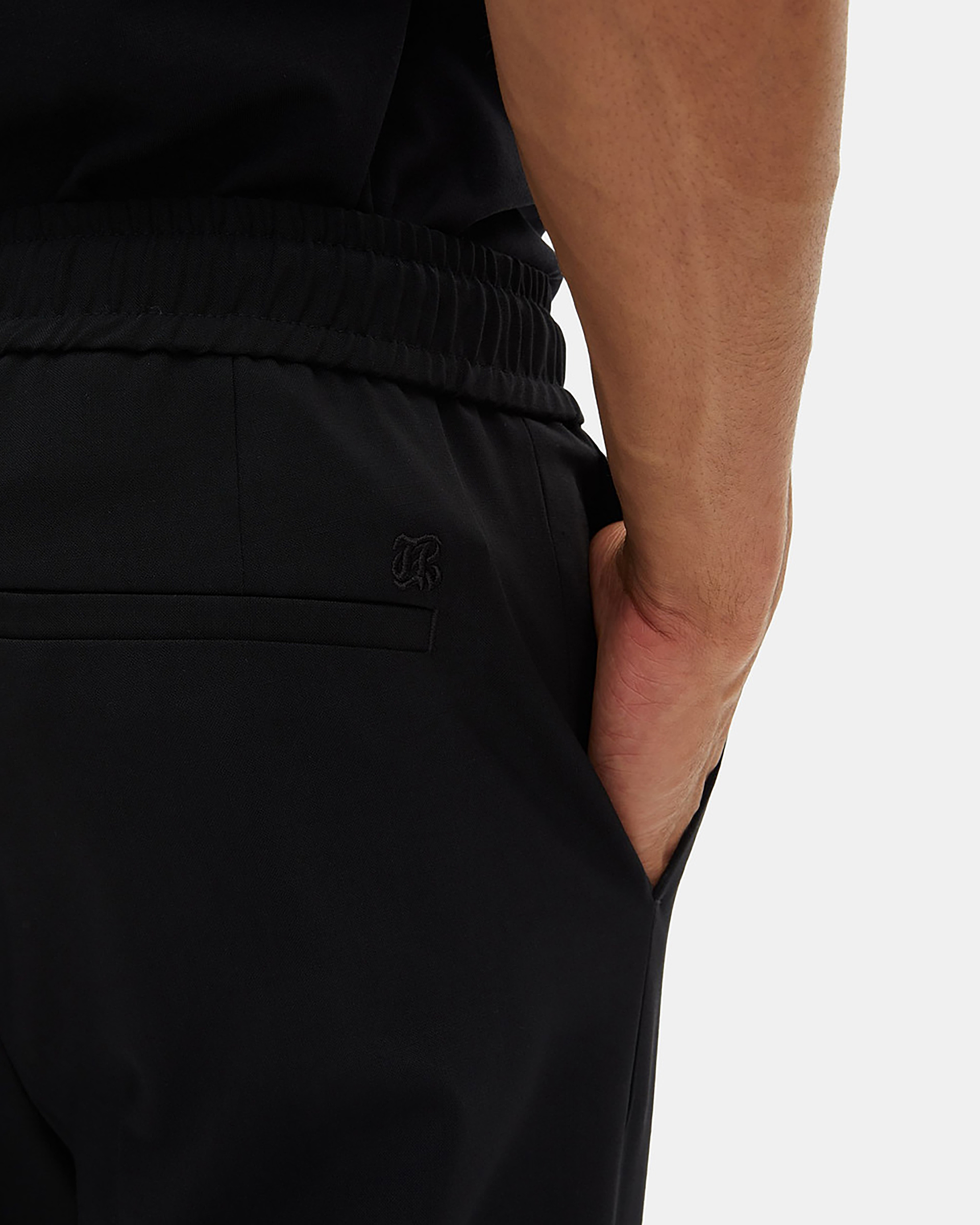 Black wool straight elasticated trousers