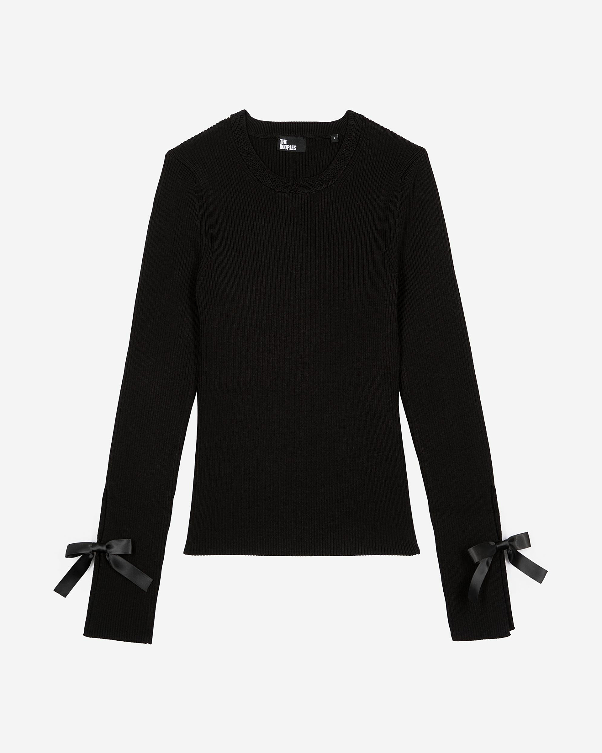 Sweater with black ribbons