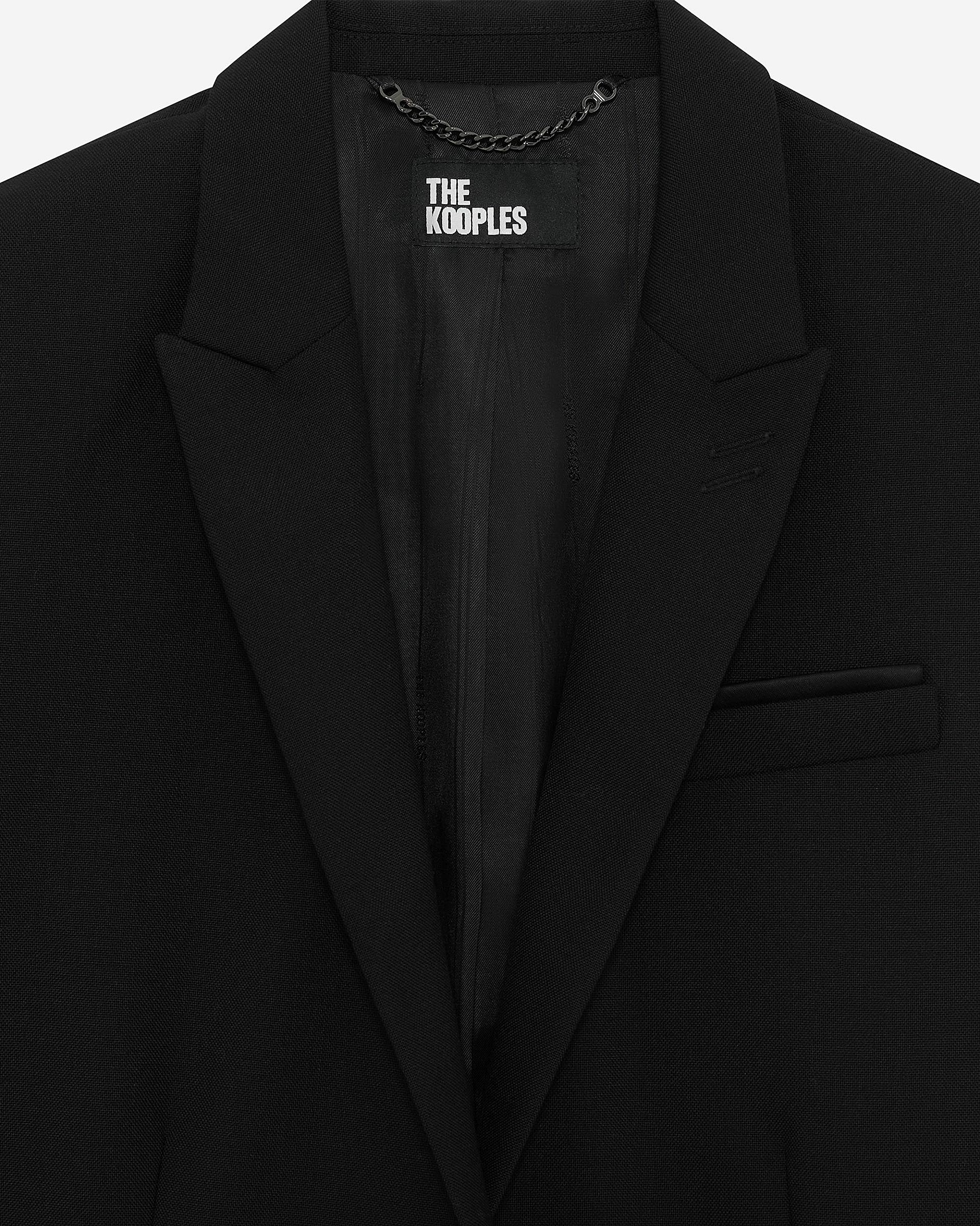 Short asymmetrical black jacket