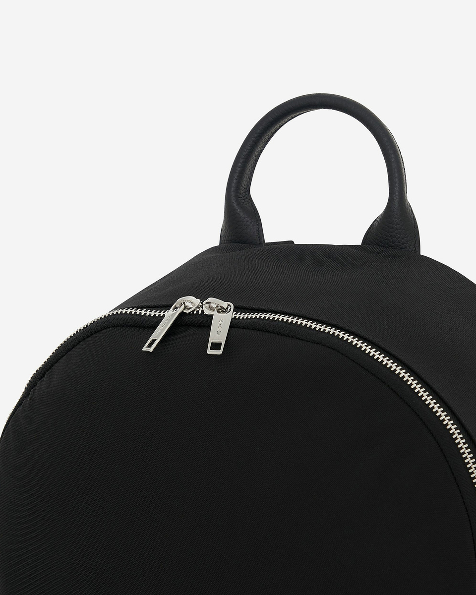 Black canvas and grained leather backpack