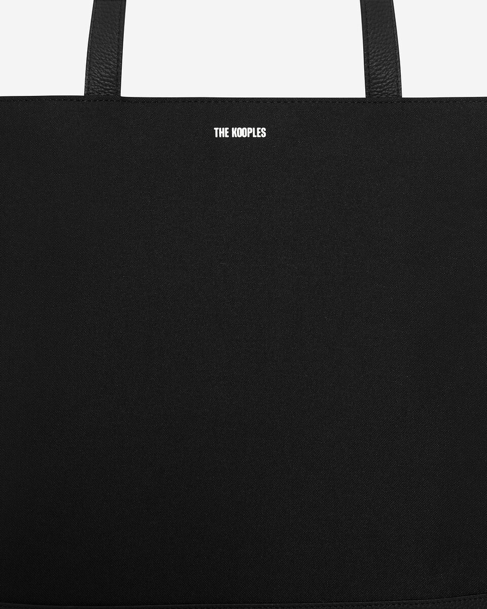 Black canvas and grained leather tote bag