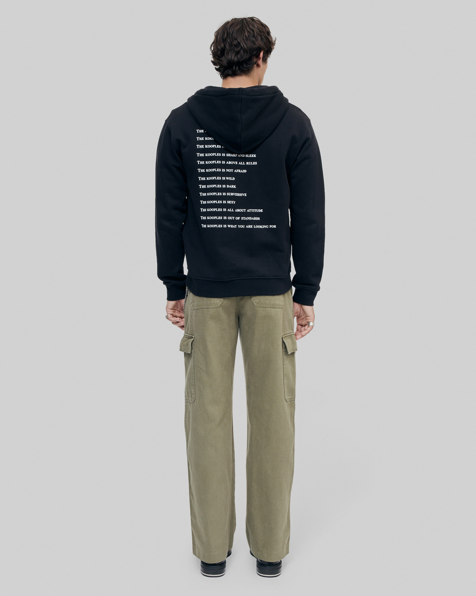 What Is Black Hooded Zip-Up Sweatshirt