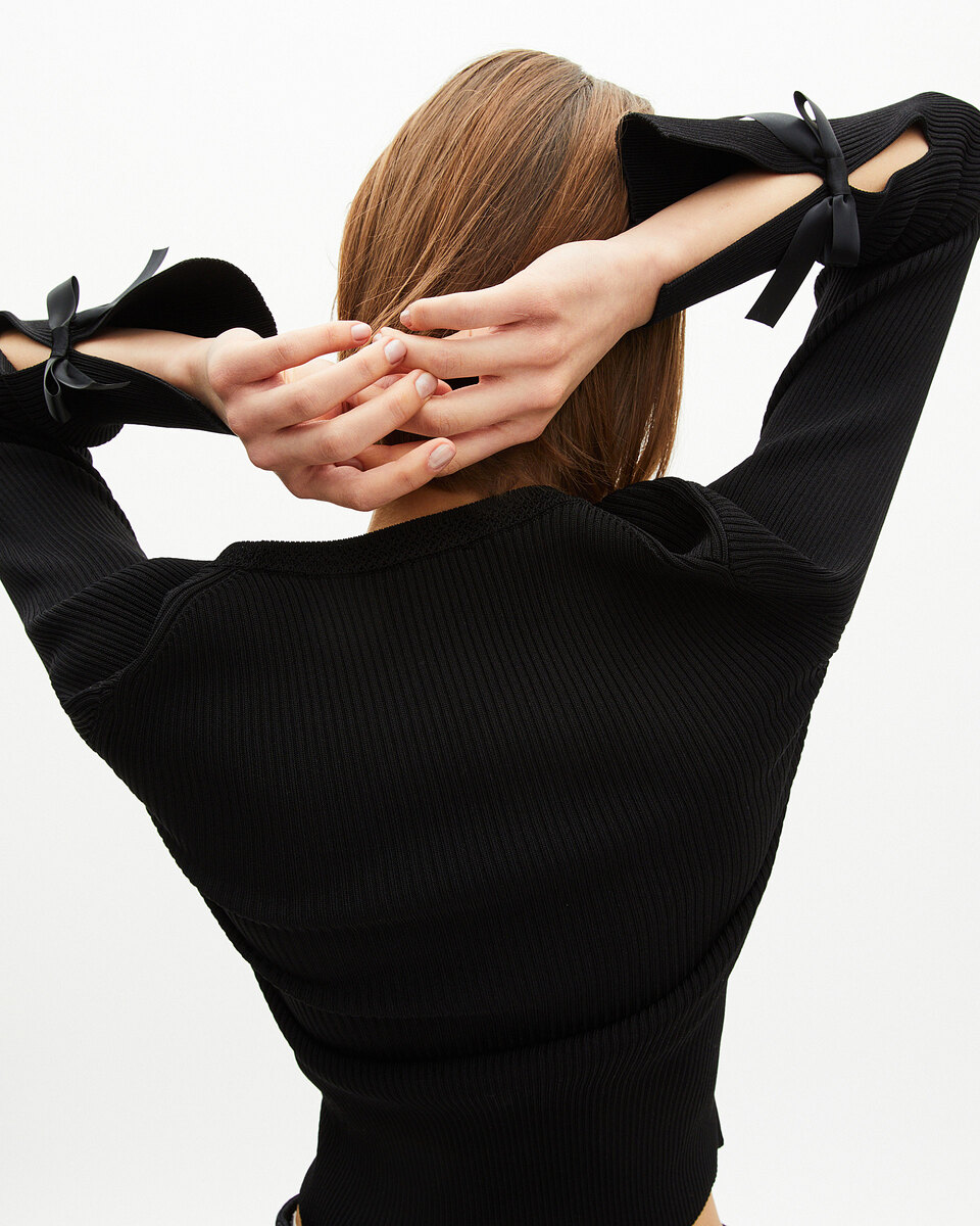 Sweater with black ribbons