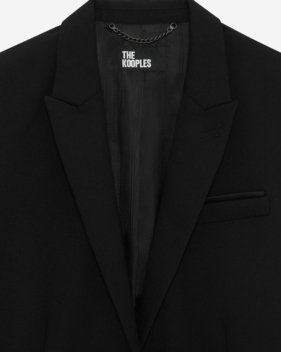 Short asymmetrical black jacket