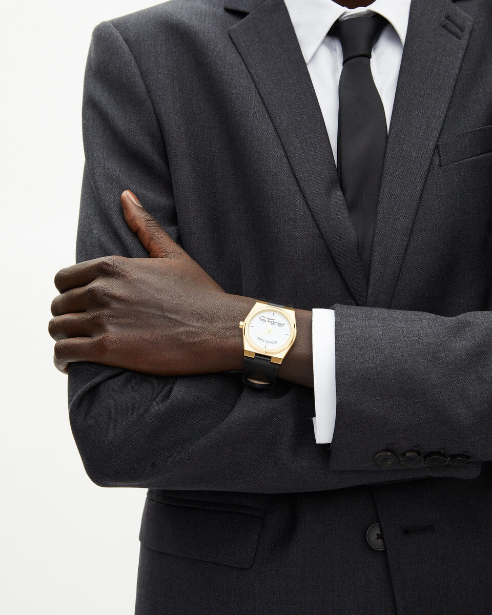 Watch with logo and black leather strap