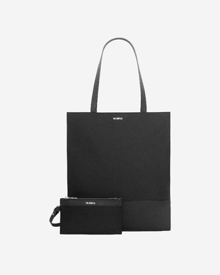 Black canvas and grained leather tote bag